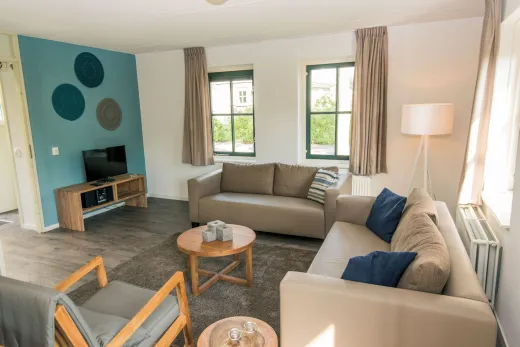 Woonkamer in 1 van de bungalows