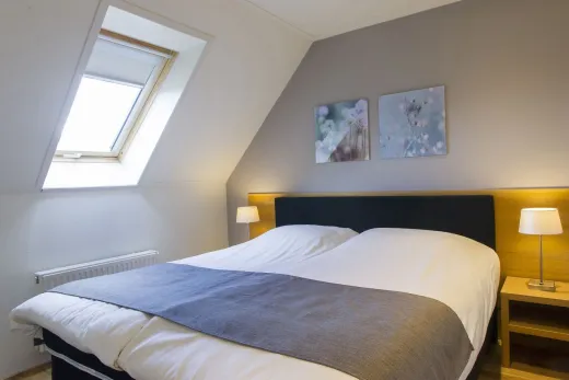 Slaapkamer in 1 van de boerderijen op Hof van Saksen